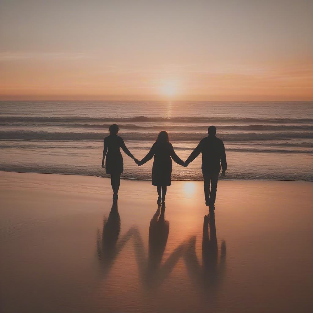 Couple Holding Hands Walking on the Beach