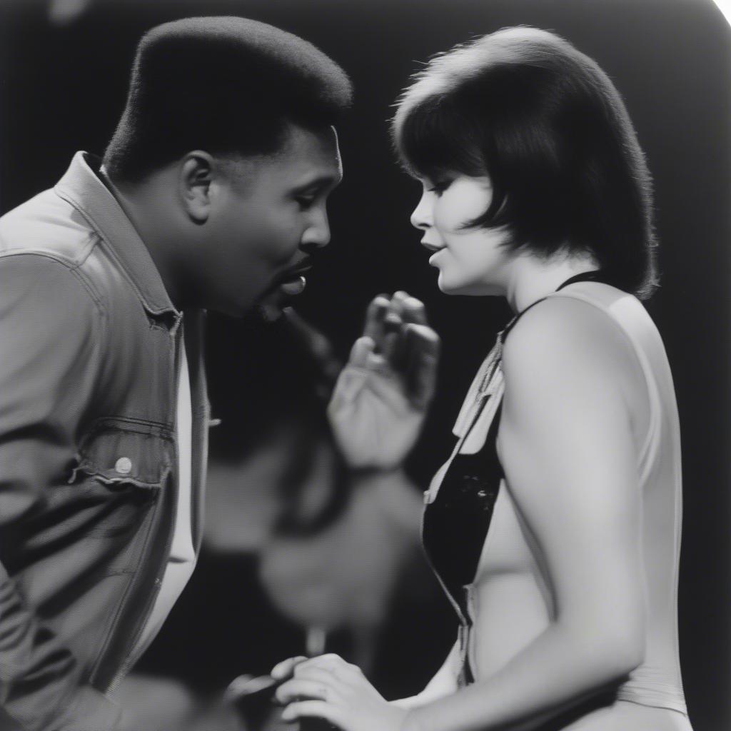 Aaron Neville and Linda Ronstadt singing "Don't Know Much"