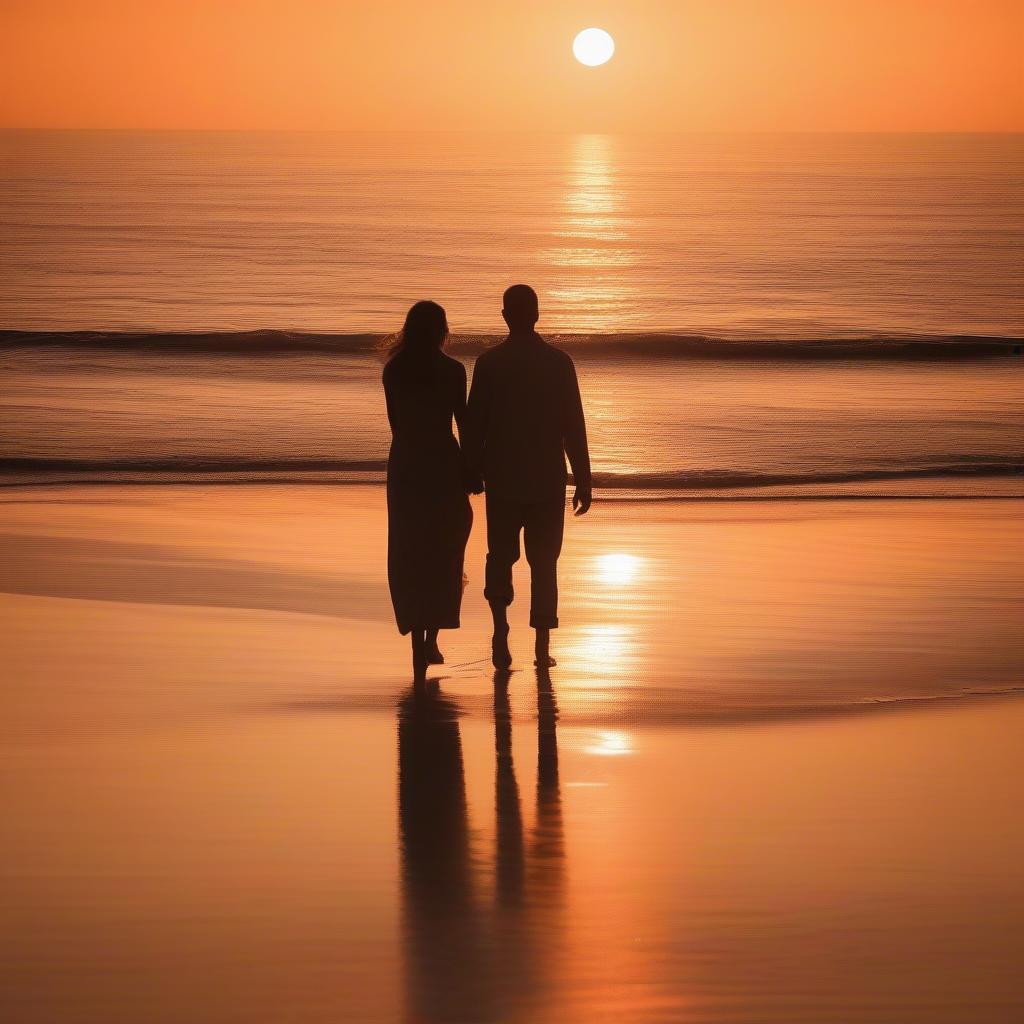 Couple Holding Hands at Sunset on a Beach