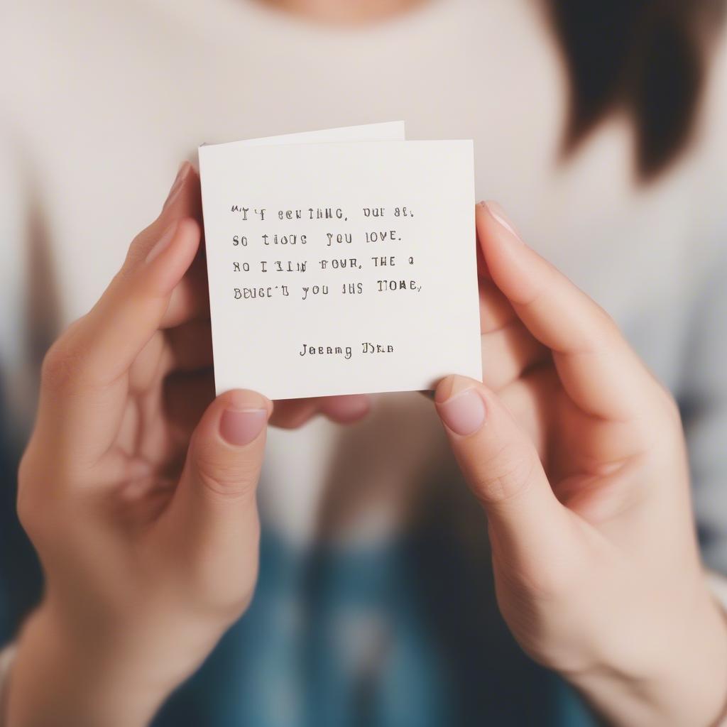 Woman smiling while reading a handwritten love note.